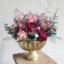 Load image into Gallery viewer, The Imogen Arrangement features peony, caspia, lavender, eucalyptus, gomphrena, gypsophila, and plumosus fern in a gold compote.
