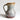 A handmade ceramic pitcher with a rounded body, a curved handle, and a small pouring spout, featuring a glazed finish with horizontal bands of blue, beige, and brown on a light gray background.